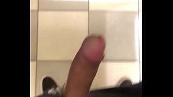 Asian Stud Stroking Hard In Public Restroom